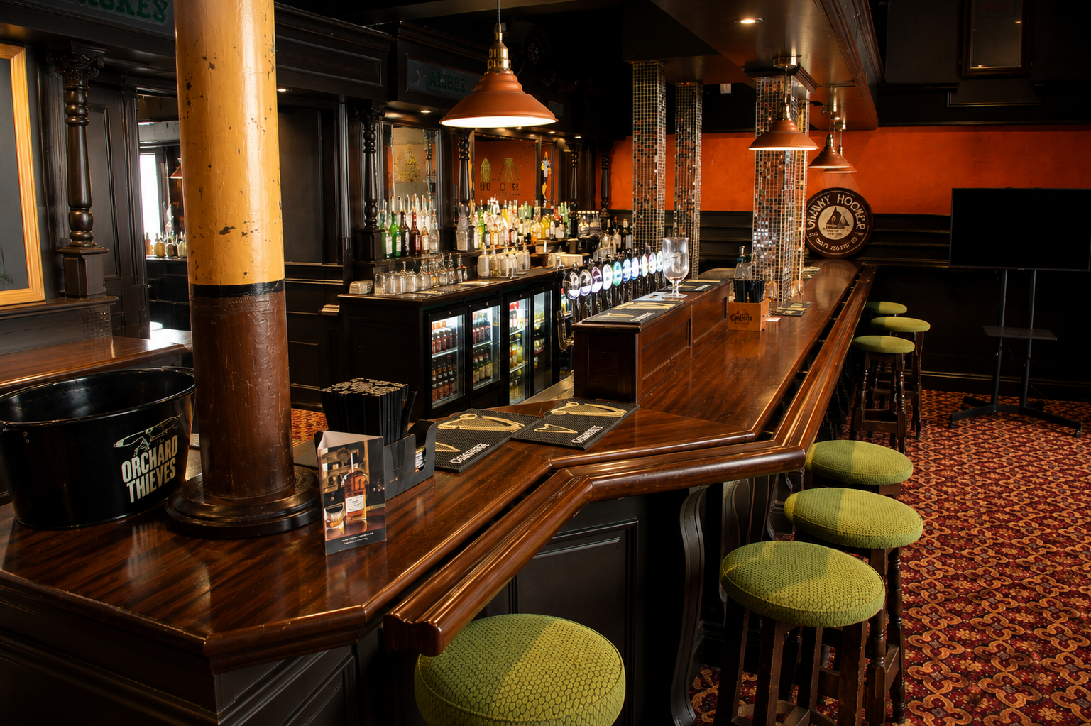 The long restored counter in the front bar at Quinn's