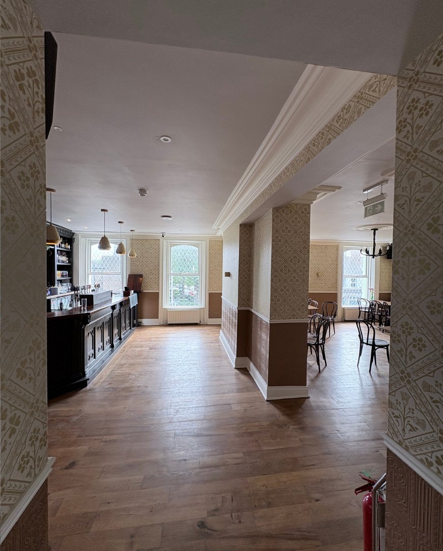 Looking down the Gold Room, past the bar to the tables